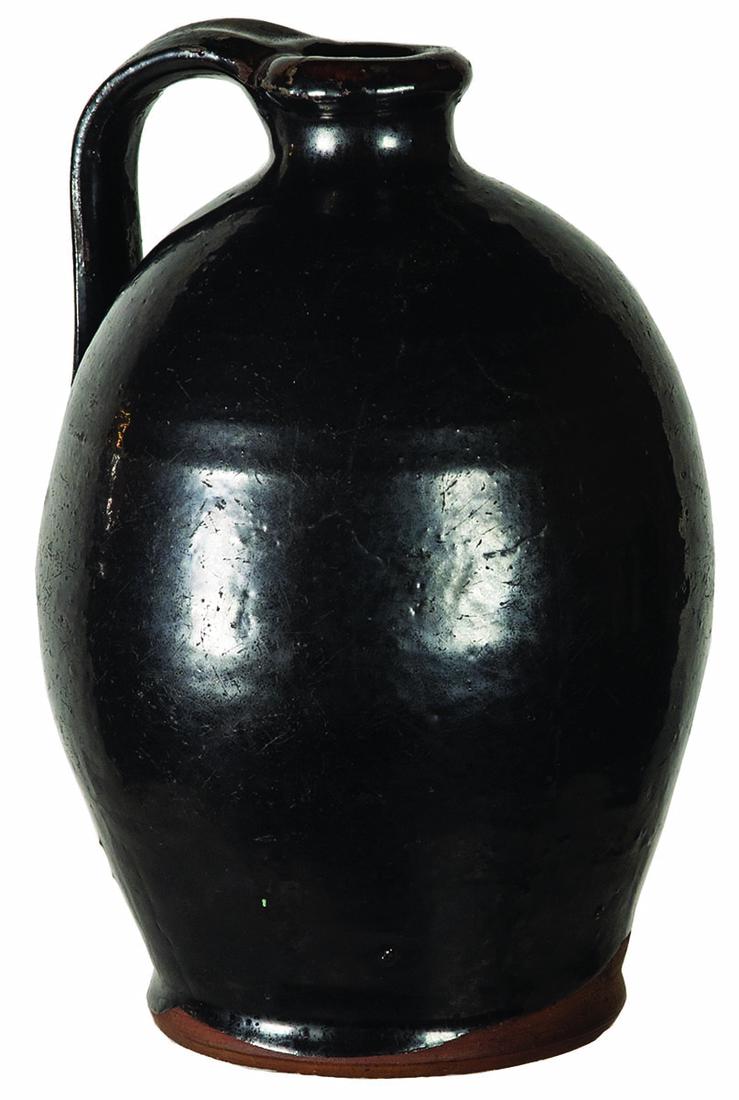 19TH C. REDWARE JUGNew England, ovoid jug, with dark: 19TH C. REDWARE JUGNew England, ovoid jug, with dark brown manganese glaze, good condition, 6 1/2" h.