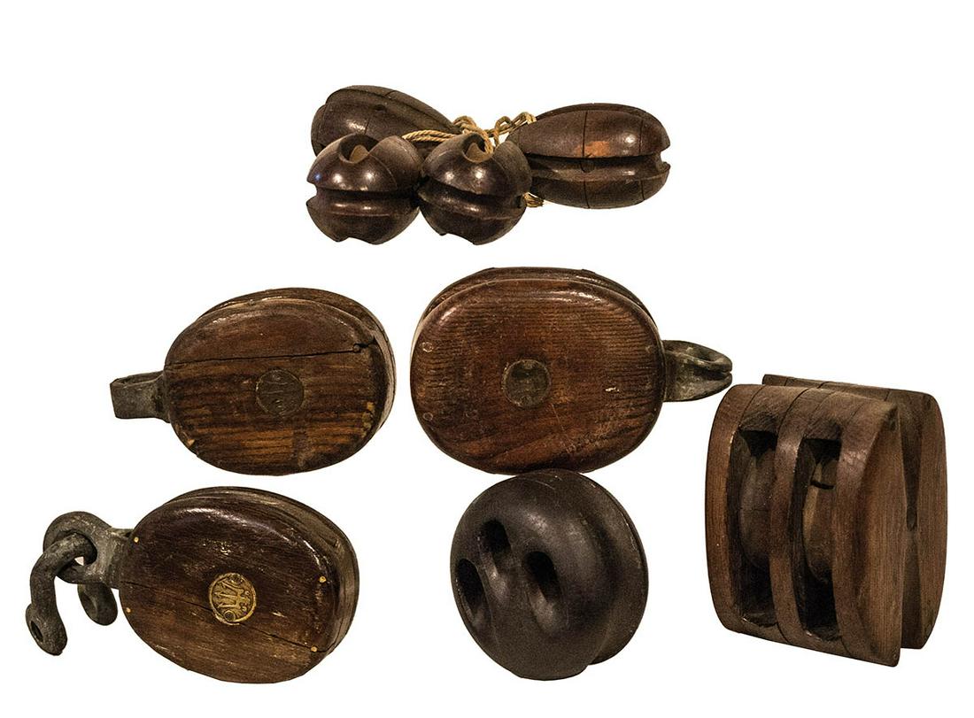 SHIP'S PULLEYS AND DEAD EYEEight ship's pulleys (three: SHIP'S PULLEYS AND DEAD EYEEight ship's pulleys (three marked with a trident), and a dead eye.