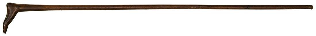 19TH C. FOLK ART CANEHandle carved in the shape of a: 19TH C. FOLK ART CANEHandle carved in the shape of a human foot, finely carved with arch and toes, 34 1/2" l.
