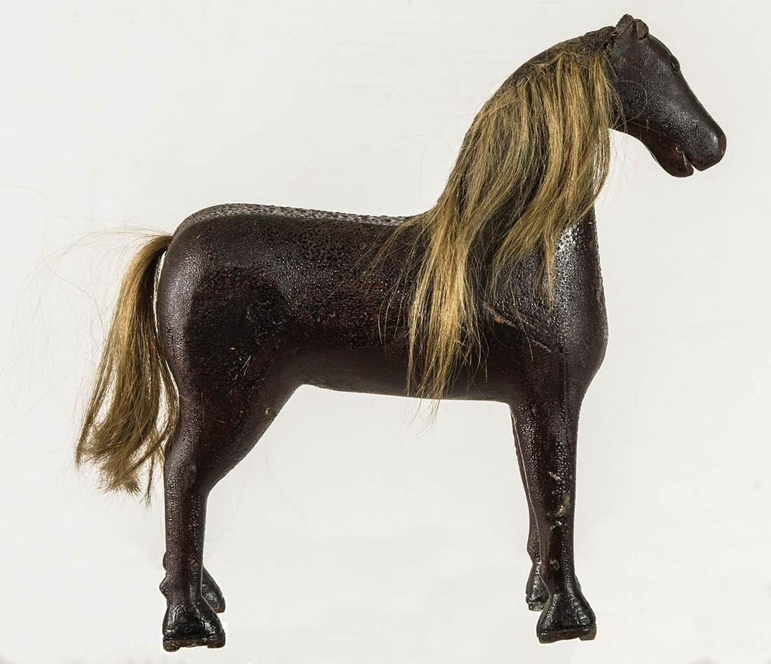 19TH C. FOLK ART CARVED WOODEN HORSEOriginal dark: 19TH C. FOLK ART CARVED WOODEN HORSEOriginal dark alligatored varnish, stained finish, copper button eyes, blonde hair mane and tail, 9 1/2" h, 9" l.