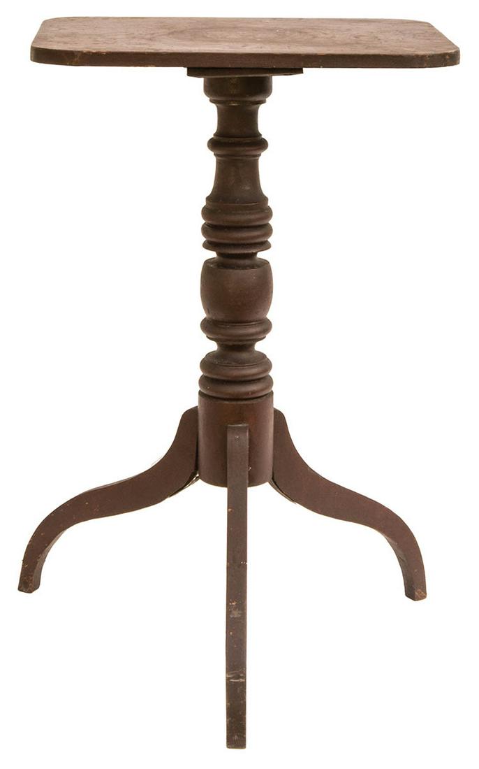 19TH C. COUNTRY CANDLESTANDCherry wood, rectangular: 19TH C. COUNTRY CANDLESTANDCherry wood, rectangular top, original Spanish brown painted finish, multiple turned shaft, spider leg, 29 1/2" h.