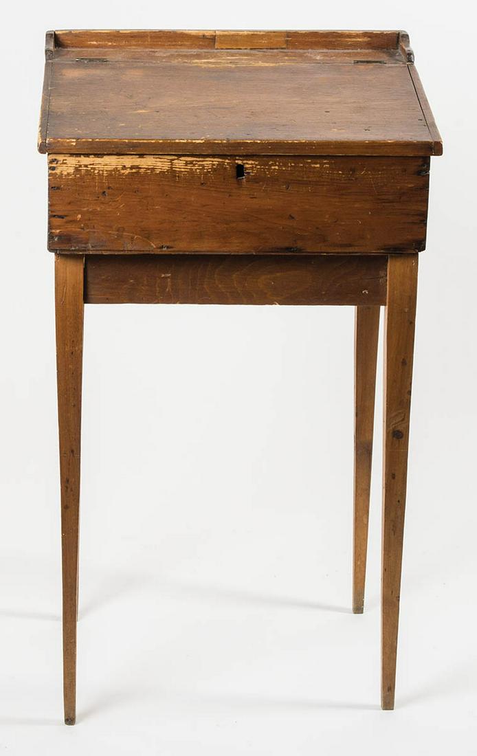 EARLY 19TH C. PINE DESKNew England, small lift lid: EARLY 19TH C. PINE DESKNew England, small lift lid desk, on square frame, on tapered square legs, in-use wear inside drawer, 29 1/2" h, 15" w, 14" d.