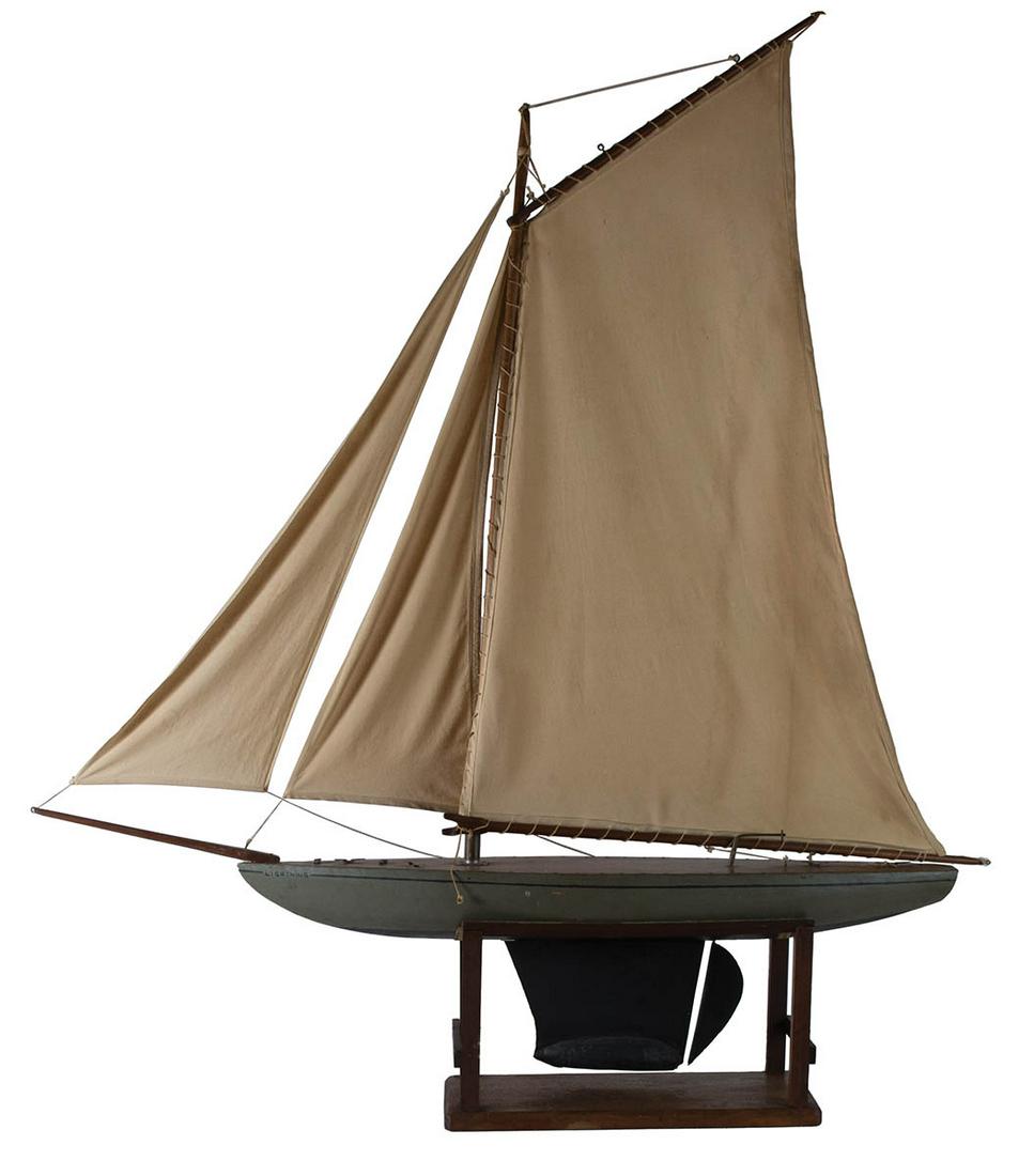 SAILING POND MODELVery fine, early large sailing pond: SAILING POND MODELVery fine, early large sailing pond model, "Lightning", three sails, on a stand, 52" h, 49" l, 8" w.