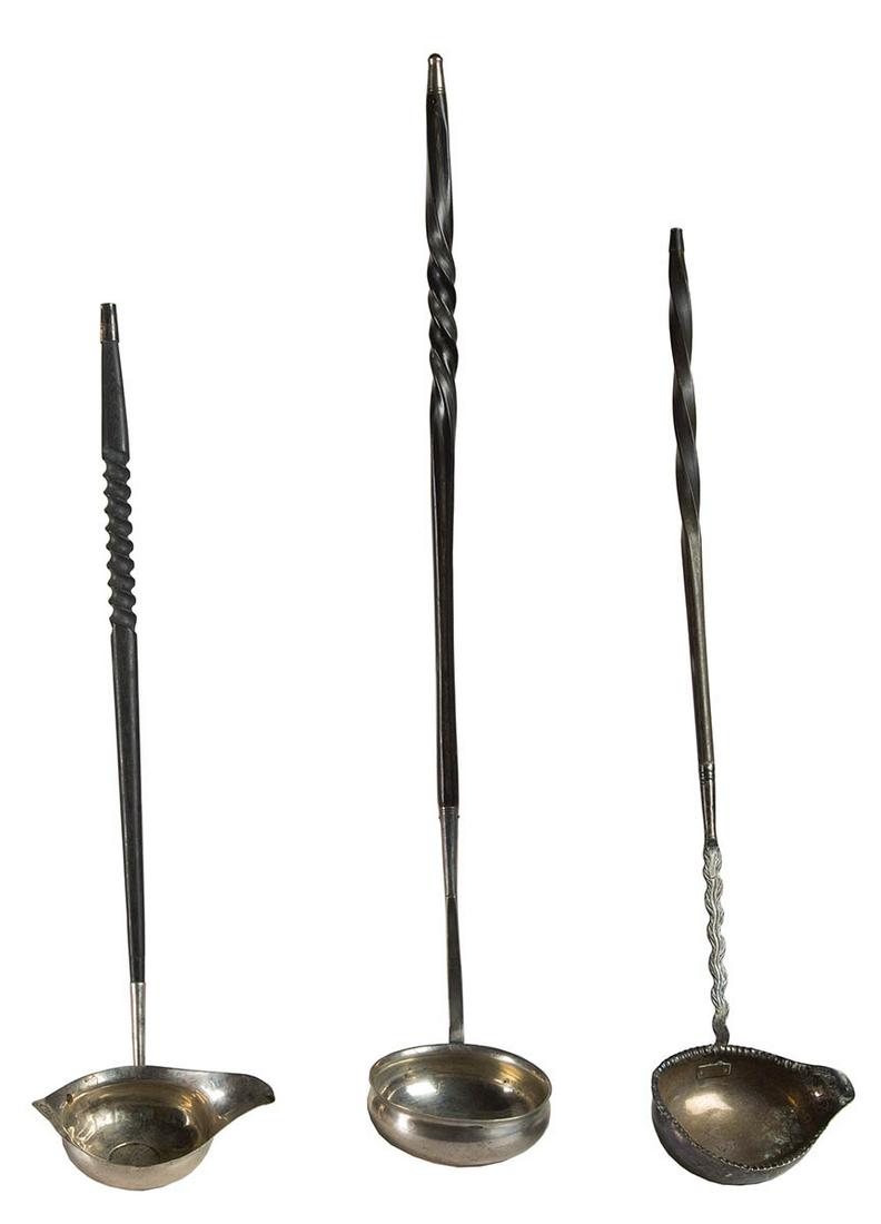 FIVE COIN SILVER PIECESThree punch ladles, (one with: FIVE COIN SILVER PIECESThree punch ladles, (one with inset central coin "Georgius II" portrait), all with twist baleen handles, 13", 14 1/2" and 16" l; Footed creamer with squared handle, hallmarked "