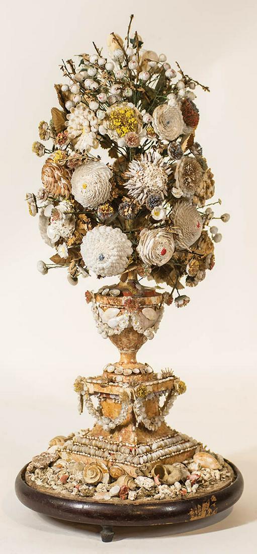 VASE OF FLOWERS MADE OF SEASHELLSVery unusual 19th c.: VASE OF FLOWERS MADE OF SEASHELLSVery unusual 19th c. vase of flowers, made entirely of tiny seashells, on a round seashell base on wood with feet, in the manner of sailor's valentines, "Sailor's Bouq