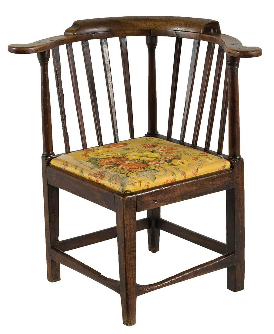 18TH C. CORNER CHAIRMahogany, curvilinear arms, 10: 18TH C. CORNER CHAIRMahogany, curvilinear arms, 10 vertical thin slats with three turned corner posts, inset seat with yellow floral upholstery, square legs with box stretcher, (back right leg restore