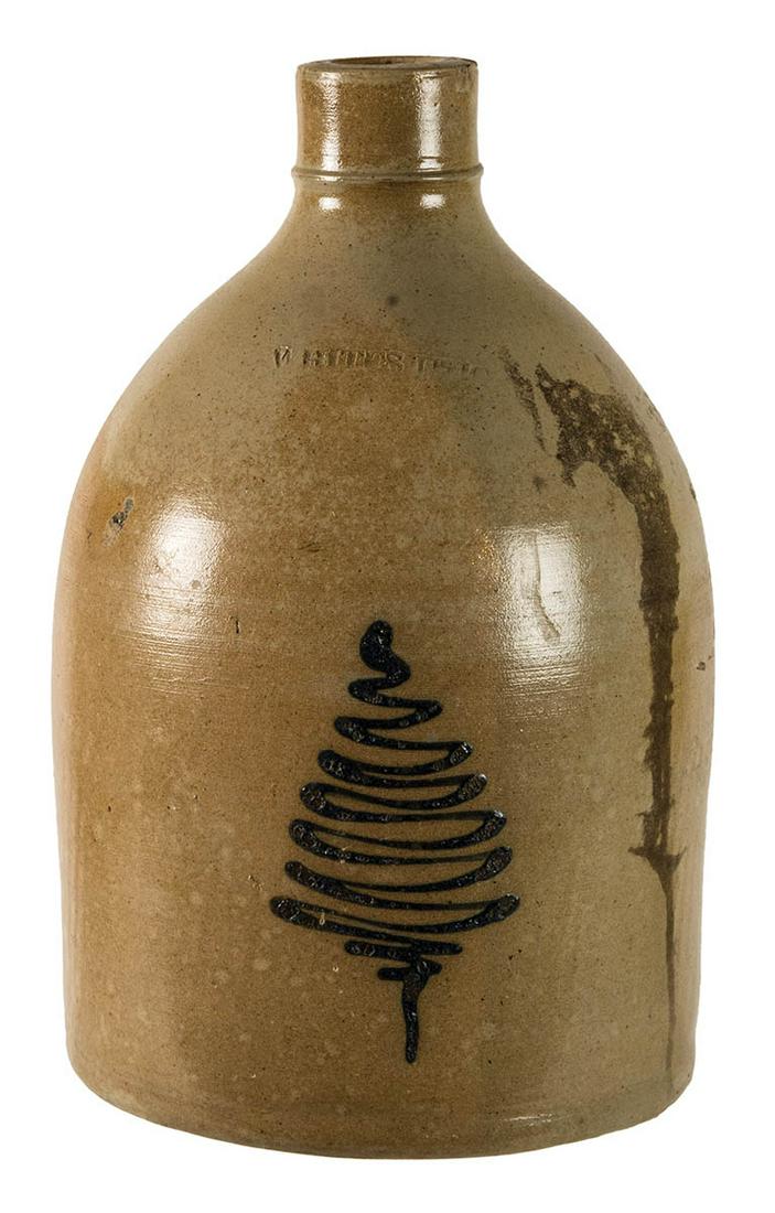 TWO 19TH C. STONEWARE JUGSOvoid with blue floral: TWO 19TH C. STONEWARE JUGSOvoid with blue floral decoration, and a straight sided jug with pine tree decoration, signed "Whites, Utica", 14" and 12" h.