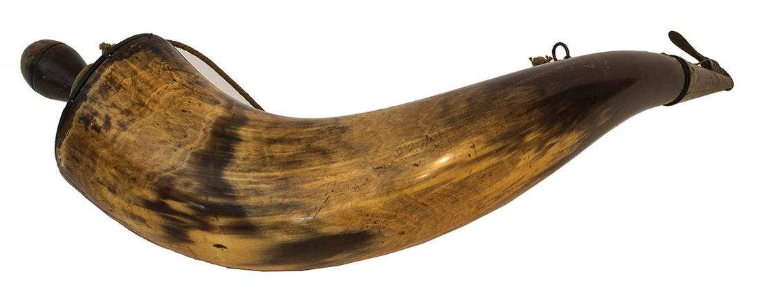 THREE POWDER HORNSHorn with red paint decoration, minor: THREE POWDER HORNSHorn with red paint decoration, minor wear, and missing its small end plug, 17 3/4" l; Large horn with damage, missing both wooden plugs, 20" l; Turned horn butt plate, and turned wo