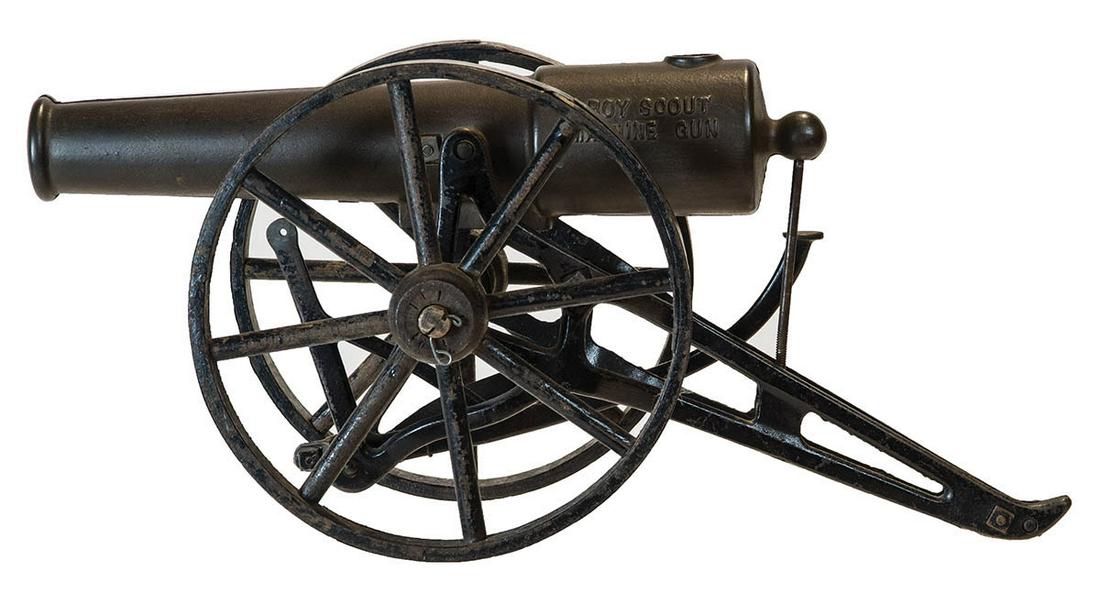 TOY STEEL CANNONWood wheels painted black, marked "Boy: TOY STEEL CANNONWood wheels painted black, marked "Boy Scouts Machine Gun", 13" l, 16" overall l, 5 1/2" w.