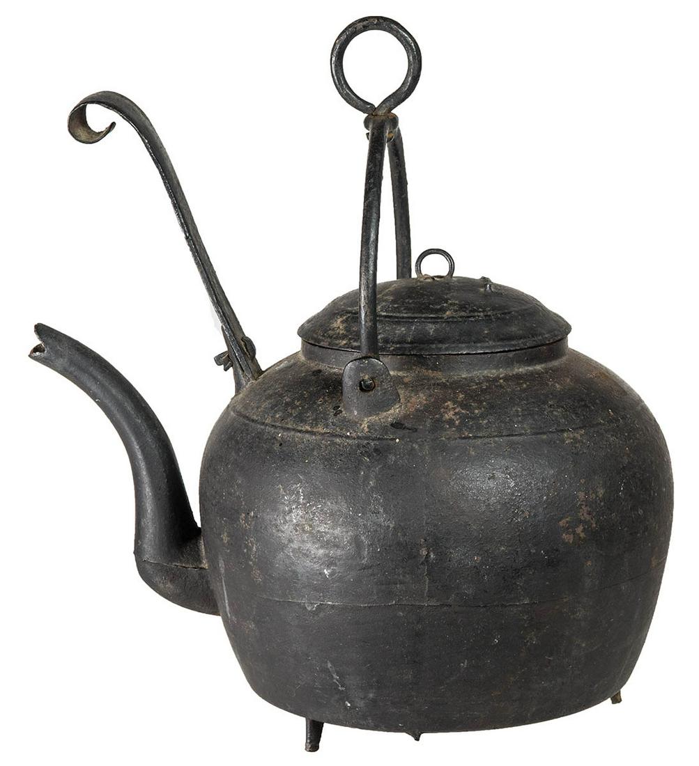 RARE 18TH C. GOOSENECK KETTLECast iron, with swivel: RARE 18TH C. GOOSENECK KETTLECast iron, with swivel ring on swing handle, intact tipper, all on three feet, 9" h, 14" h to top of ring, original cast lid with ring.