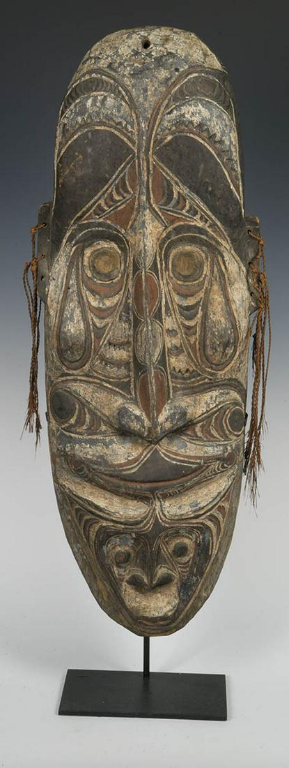 RARE NEW GUINEA MASKPapua, New Guinea 19th c. ancestor: RARE NEW GUINEA MASKPapua, New Guinea 19th c. ancestor mask, collected in Kaminibit village, Middle Sepik, c. 1950, (ex. St. Paul Missionary collection, Australia), custom mounted on a stand, (ex. Art