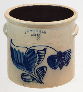 19TH C. STONEWARE CROCKThree-gallon crock, "NA White &: 19TH C. STONEWARE CROCKThree-gallon crock, "NA White & Son, Utica, N.Y.", very large cobalt blue, leafy blue flower with variegated leaves, overall good condition, 10 1/2" h, 11 1/2" dia.