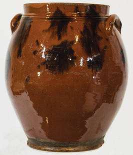 EARLY 19TH C. OVOID REDWARE CROCKCrock with handles,: EARLY 19TH C. OVOID REDWARE CROCKCrock with handles, coggle lines just below rim at upper shoulder, orange/red glaze with bold manganese splotches, minor rough around lip, overall good condition, 11"