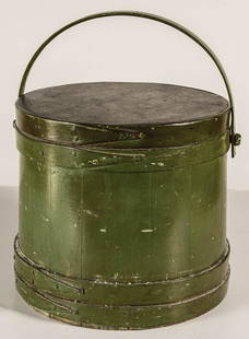 EARLY 19TH C. FIRKINLarge green painted firkin, with: EARLY 19TH C. FIRKINLarge green painted firkin, with gilt and black paint decorated lid, with a pineapple and flower motif, rosehead nail construction, found in Duxbury, MA, 14" h, 15 1/2" dia.