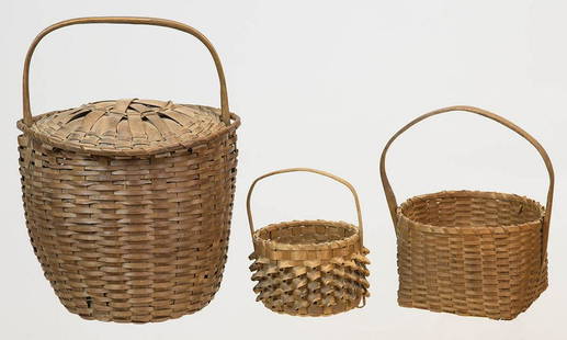 THREE EARLY HOOP HANDLED BASKETSRound basket with: THREE EARLY HOOP HANDLED BASKETSRound basket with sliding lid (possibly for gathering goose down), signed on bottom in script "W.S. Tower", 8" h (to rim); Small basket, (Penobscot Indian, Maine),