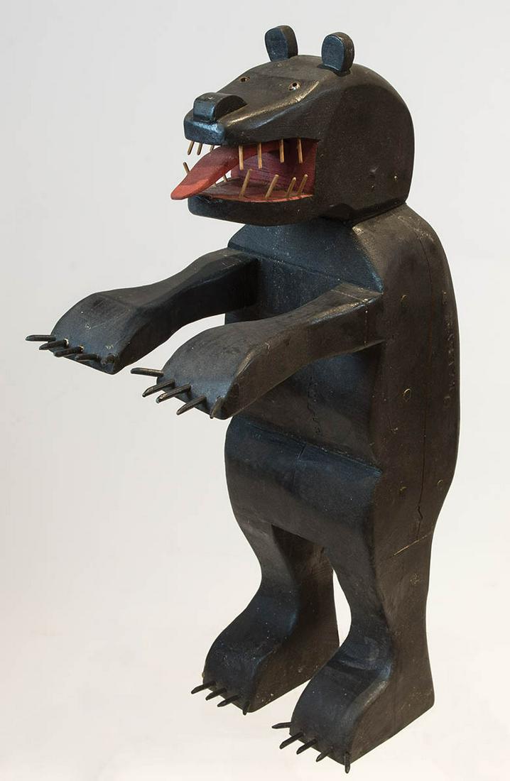 FOLK ART CARVED BLACK BEARStanding bear with carved: FOLK ART CARVED BLACK BEARStanding bear with carved teeth, protruding tongue, claws (one toe claw missing), stamped "Hardy" in two places, some age shrinkage, 31" h, 17" d.