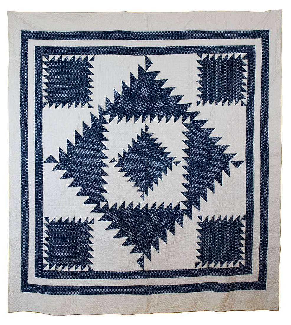 FULL SIZE EARLY 20TH C. QUILTBlue and white: FULL SIZE EARLY 20TH C. QUILTBlue and white "Sawtooth/Diamond in the Square", very fine graphics, with double blue border, 72" x 76".