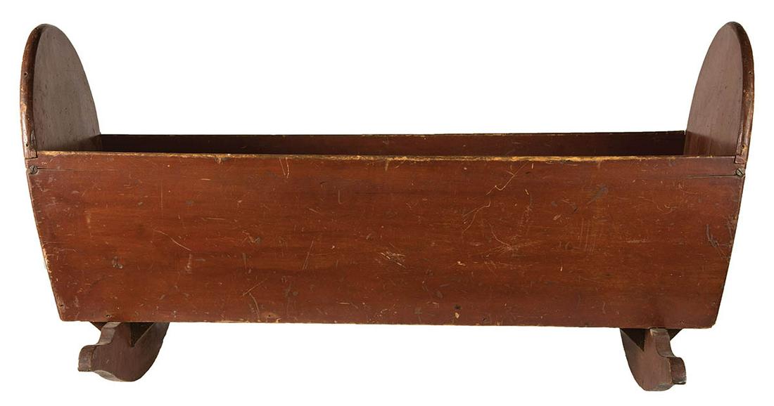 CHILD'S CRADLEPine, original red painted finish, two brass carrying handles, ends rounded, (1 of 2)