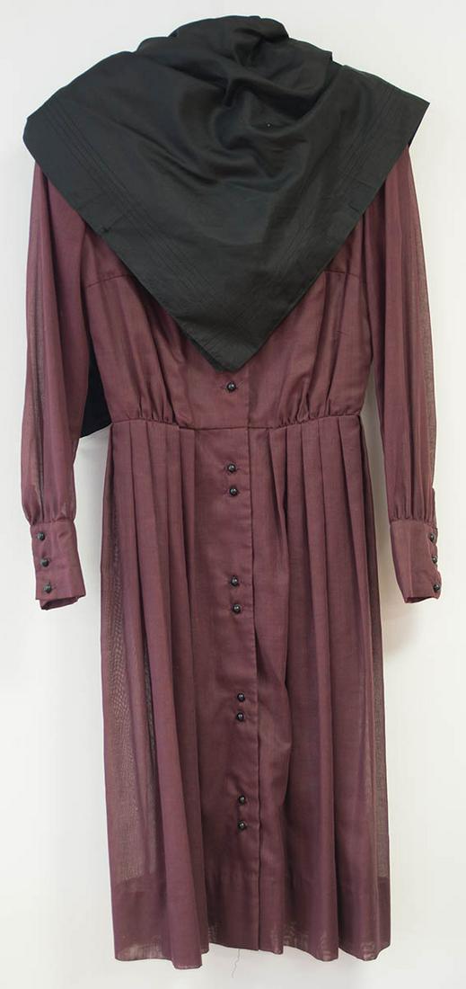 SHAKER DRESS AND NECKERCHIEFCotton, dyed dark wine purple, long sleeves with three black buttons on: SHAKER DRESS AND NECKERCHIEFCotton, dyed dark wine purple, long sleeves with three black buttons on the cuffs, double row of black round buttons down the front (one button missing), five pleats on eac