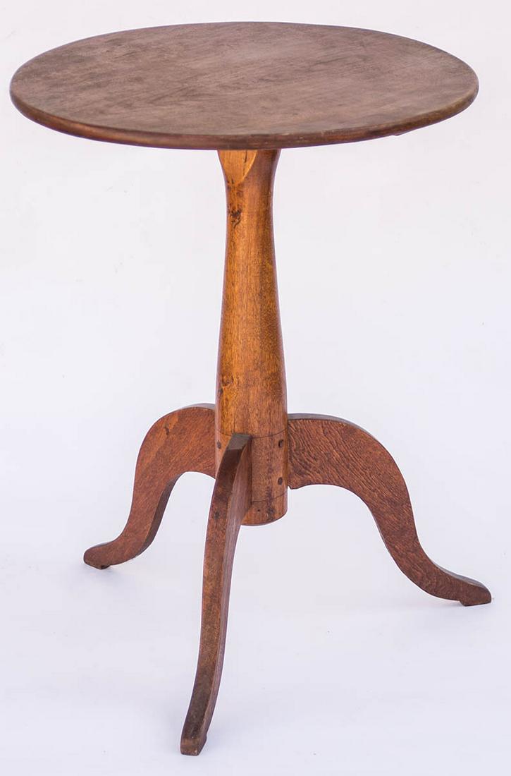 CANDLESTANDBirch, traces of original red stain with varnish over, round top (18" dia), carved and: CANDLESTANDBirch, traces of original red stain with varnish over, round top (18" dia), carved and turned shaft, pegged into a rectangular cleat, with symmetrically aligned handmade screws, high arched