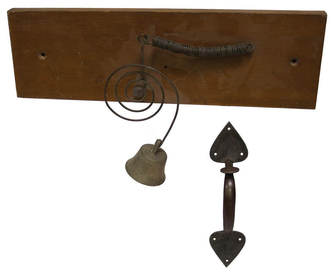 DOOR LATCH AND SHOP ENTRY BELLClassic form, cast iron Shaker door latch, with spade shaped top and: DOOR LATCH AND SHOP ENTRY BELLClassic form, cast iron Shaker door latch, with spade shaped top and bottom, 10" h; and a rare Shop Bell, cast iron on a spring mechanism, attached to a rectangular pine 