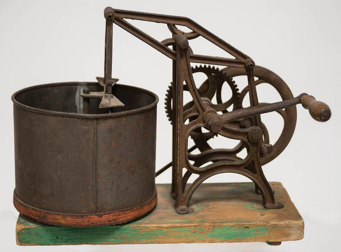 MECHANICAL CHOPPING DEVICERevolving tin tub with interior blade, with multiple levers and gears, and: MECHANICAL CHOPPING DEVICERevolving tin tub with interior blade, with multiple levers and gears, and a handle which controls the chop blade, all mounted on a pine plank, (note: possibly to chop apples