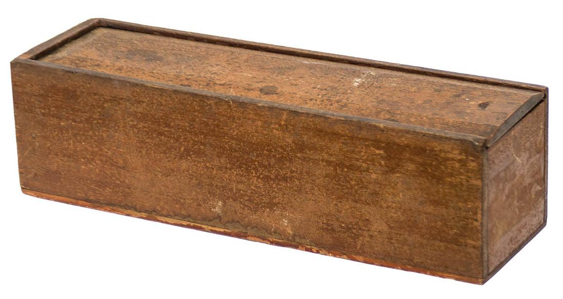 SISTER'S SLIDE LID BOXPoplar and pine, original reddish stained varnish finish, used to store: SISTER'S SLIDE LID BOXPoplar and pine, original reddish stained varnish finish, used to store knitting needles, Sister's paper label inside the end board "Mary Page", labeled inside "G.A.M.", c. 1850,
