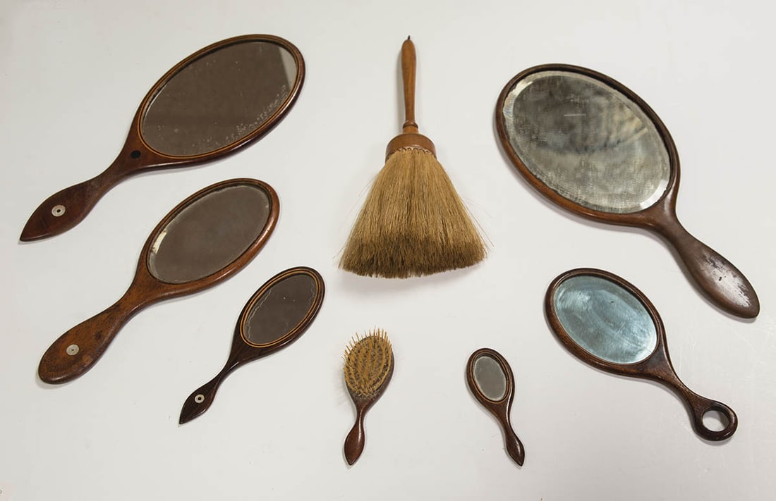 COLLECTION OF SEVEN OVAL HAND MIRRORS, AND A BRUSH Tapering handles, one small example with a (1 of 1)