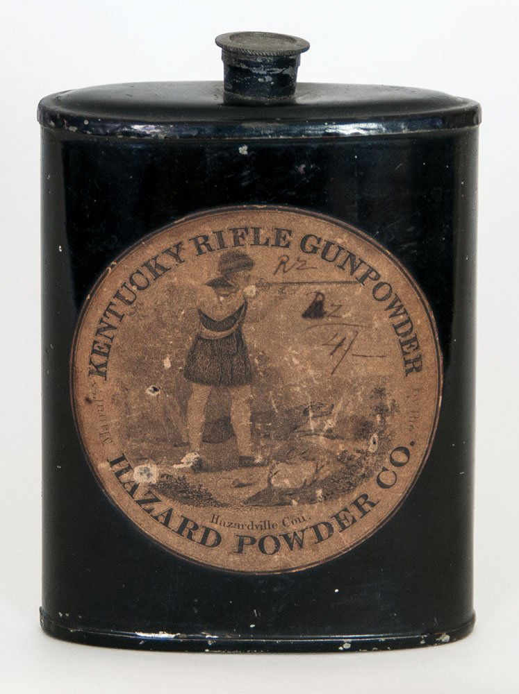 Black painted gun powder tin, 5" h: ANTIQUE GUN POWDER TIN Painted black, original round paper label "Kentucky Rifle Gunpowder, Hazard Powder Co., Hazardville, Con.", showing a hunter with long rifle and his dog, original pewter screw-o