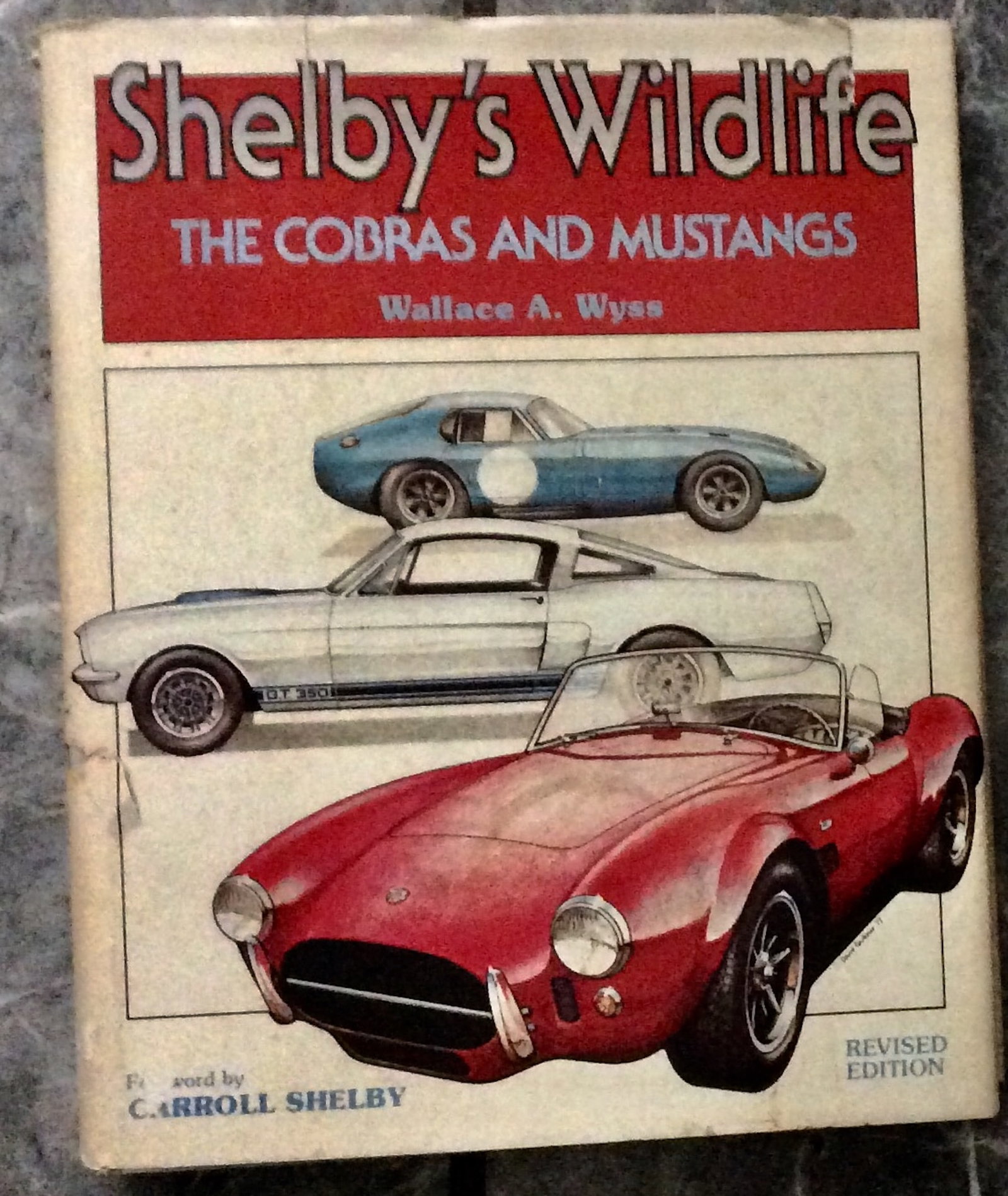"Shelby's Wildlife: The Cobras & Mustangs" by Wallace Wyss Hardcover 1979 Definitive Biography Of: Hardcover 1979 Definitive History Of Carroll Shelby's Muscle Cars Revised Edition In Dust Jacket. "Shelby's Wildlife: The Cobras & Mustangs" by Wallace Wyss. HARDCOVER 1979 Motorbooks International St