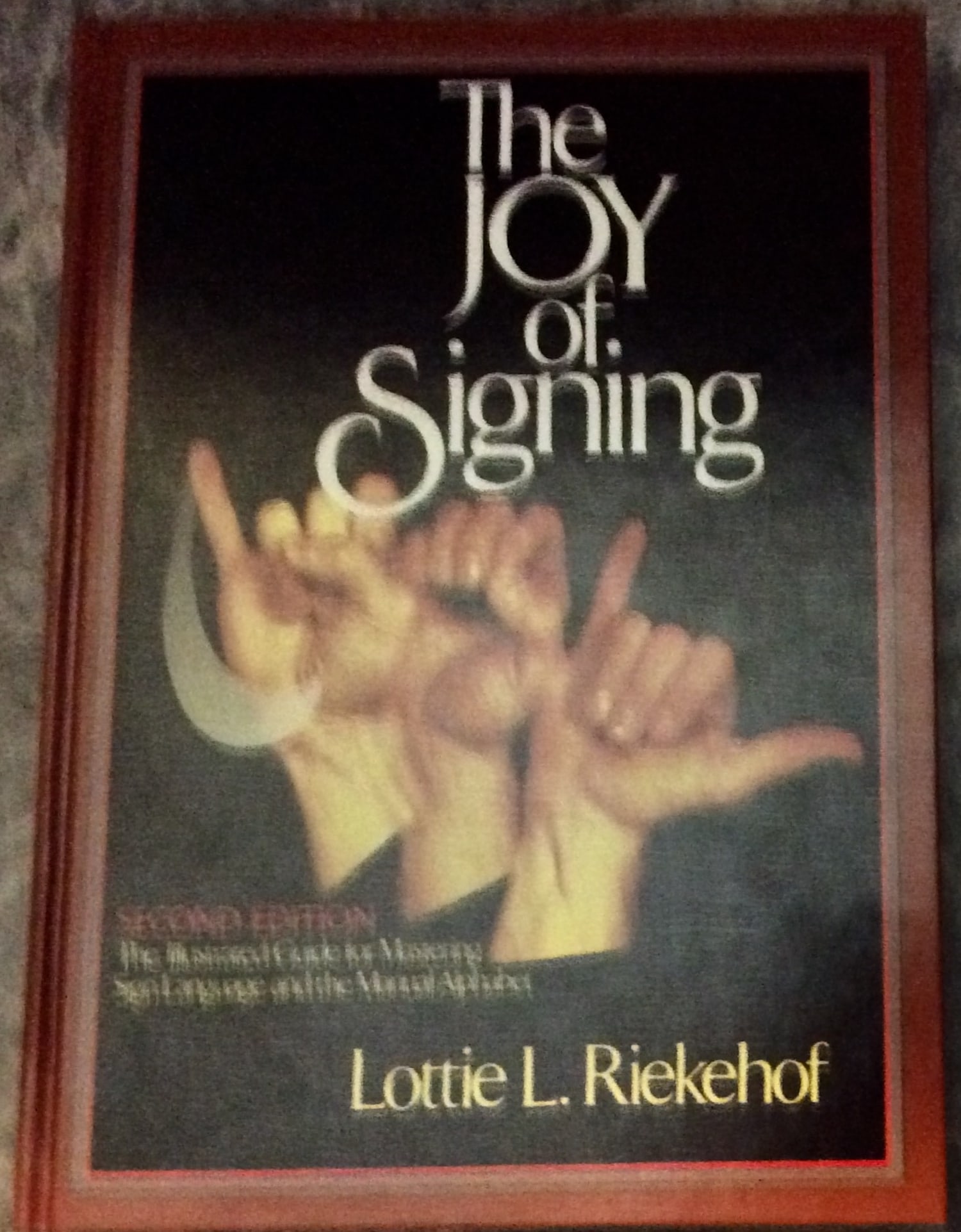 "The Joy of Signing" by Lottie Riekehof Hardcover 1987 Illustrated Sign Language Reference: Hardcover 1987 Illustrated Sign Language Reference. "The Joy of Signing: The Illustrated Guide for Mastering Sign Language and the Manual Alphabet" by Lottie Riekehof. HARDCOVER 1987 Gospel House Publ