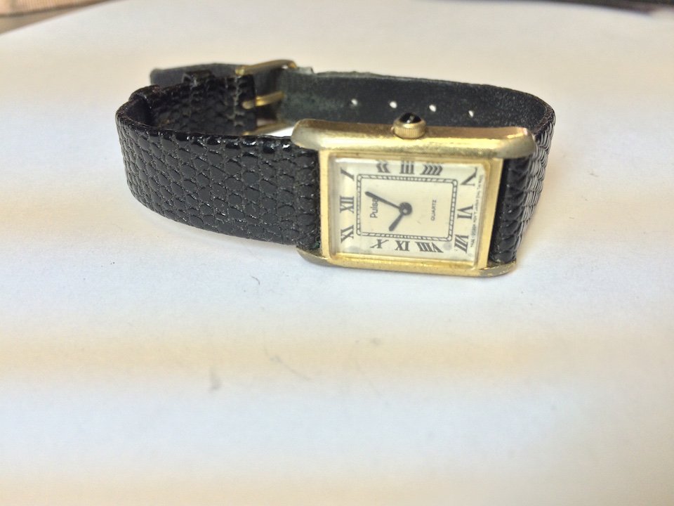 stainless steel pulsar watch with leather band: stainless steel pulsar watch with leather band. 5 inches band