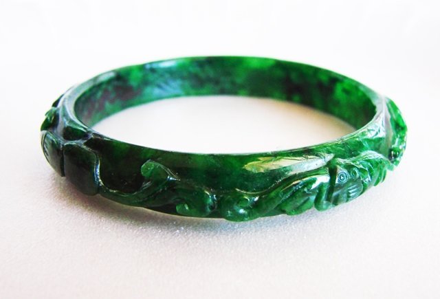 Maw-Sit-Sit Carved jade Bangle Imperial Grade A: Jade Type: Natural Maw-Sit-Sit Carved Leaf/Fish Jade Qty: 1 Item: Carved Jade Bangle Grade: A Clarity: Deep Polish, Translucent, Color: Deep Imperial Green/Black Spot Luster: Excellent Origin: Burma<