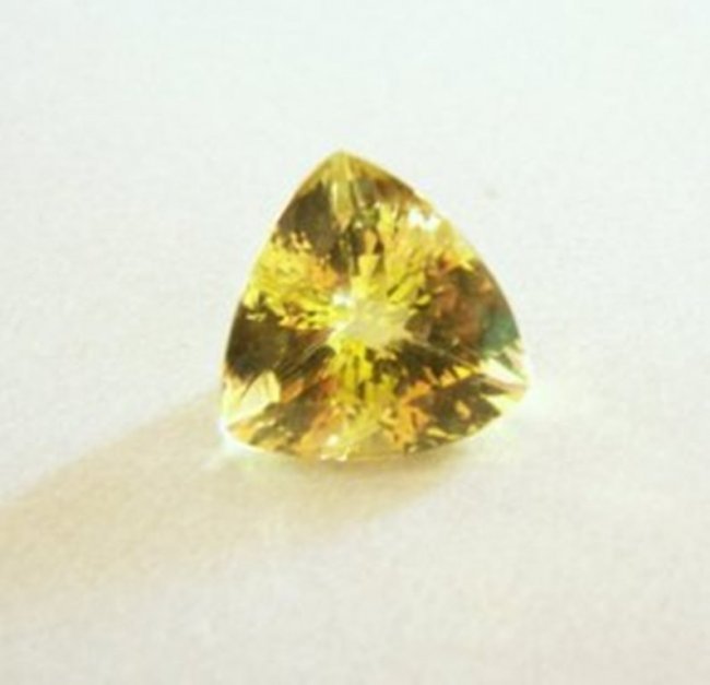 Loose Natural Lemon Topaz Trillion Shape 13.01Ct: Gem Type: Natural Lemon Topaz Qty: 1 Weight: 13.01 Carat Measurement: 16.2x16.2x10.4mm Shape: Trillion Facet Clarity: VS Color: Light Yellow Origin: Brazil Estimate Value Price $620