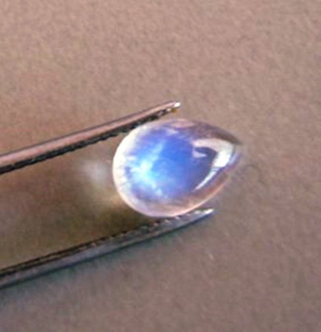 Blue White Rainbow Moonston Pear 1.67Ct 9.8x7x3.4mm: Gem: Natural Moonstone Qty: 1 Weight: 1.67 Carat Pear Shape Cut: Cabochon Measurement: 9.8 x 7x 3.4mm Clarity: Transparent Color: Blue White Rainbow Treatment: None Origin: Sri Lanka (Ceylon)