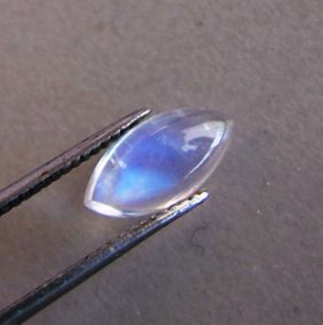 Blue White Rainbow Moonstone Marquise 1.89Ct: Gem: Natural Moonshine Qty: 1 Weight: 1.89 Carat Marquise Shape Cut: Cabochon Measurement: 11.8 x 6 x 3.7mm Clarity: Transparent Blue White Rainbow Treatment: None Origin: Sri Lanka (Ceylon)