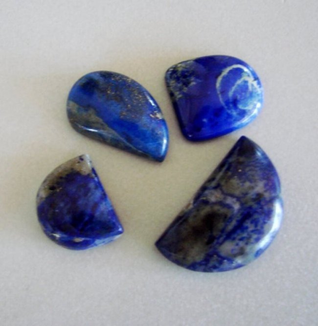 Natural Royal Blue Lapis Lazuli Lot 4Pcs/69.34Ct: Gem Type:Natural Royal Blue Lapis Lazuli Cabochon 4 Pieces Weight: 69.34 carat Cabochon Haft Oval,Haft Round,Pear Clarity: Opaque,Color:Royal Blue,Treatment:None Hardness:5.5 Measurement:28x13/23x14.1
