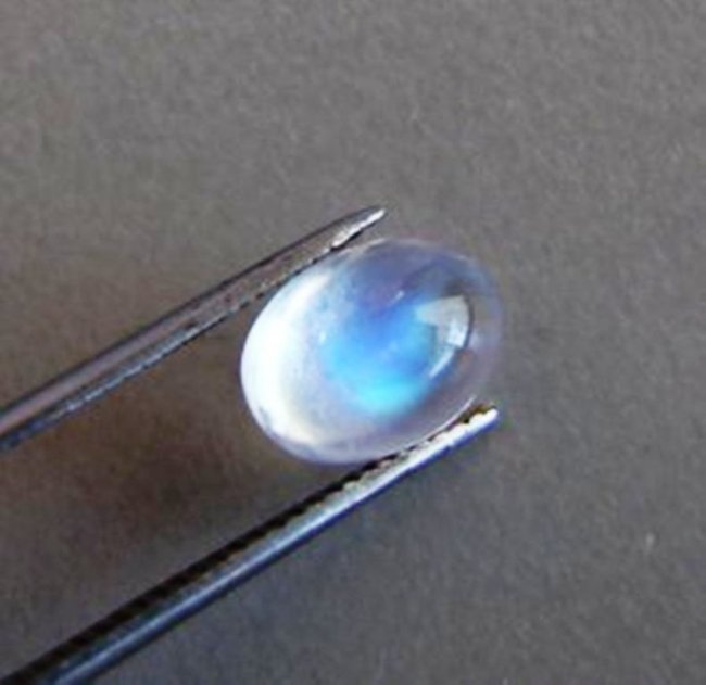 Blue White Rainbow Moonston Oval 3.06Ct 10x7.4x5.5mm: Gem: Natural Moonstone Qty: 1 Weight: 3.06 Carat Oval Shape Cut: Cabochon Measurement: 10 x 7.4 x 5.5mm Clarity: Transparent Color: Blue White Rainbow Treatment: None Origin: Sril Lanka ( Ceylon
