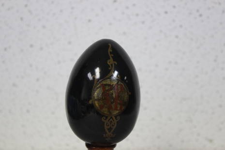 A Russian Folk Art Egg: Lacquer - 3 1/4" long - signed