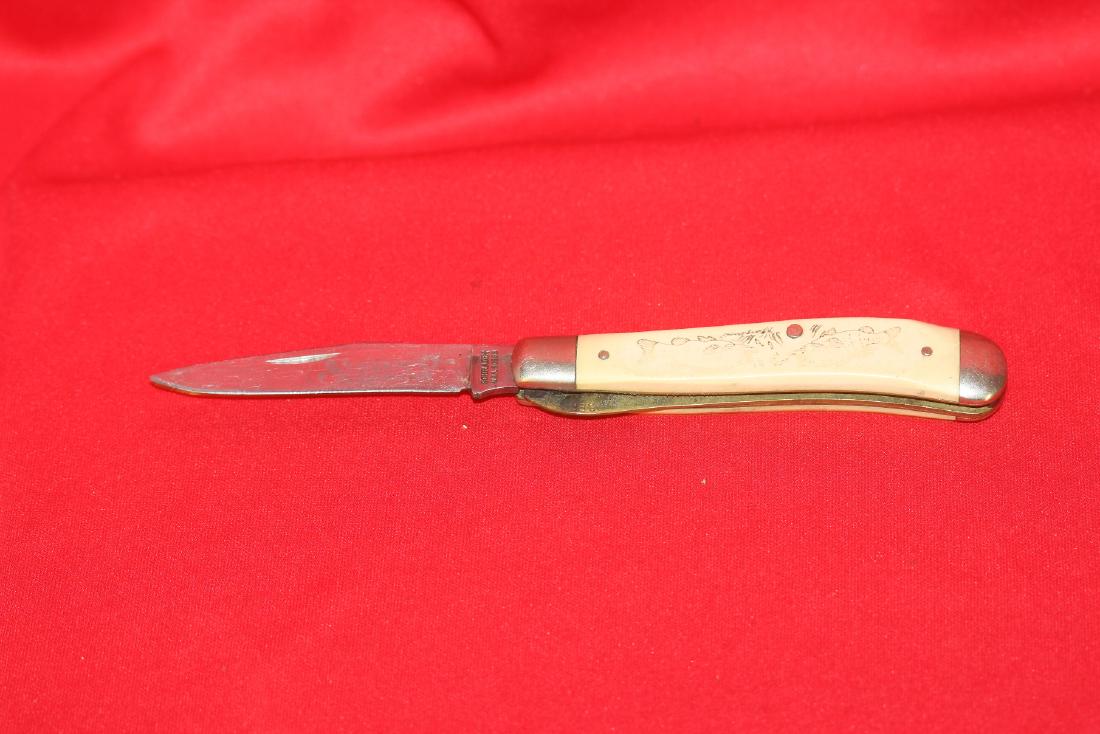 A Schrade Scrimshaw Pocket Knife: 4" long when folded