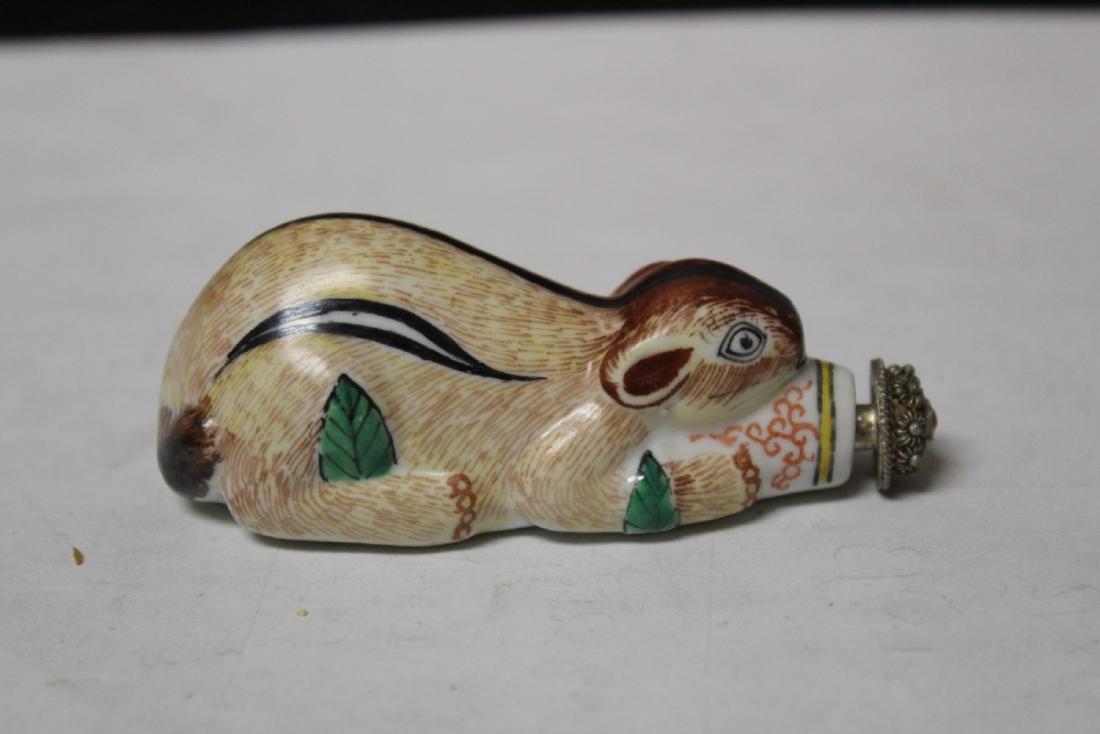 A Chinese Porcelain Snuff Bottle: in the form of a squirrel - 3 1/4" long