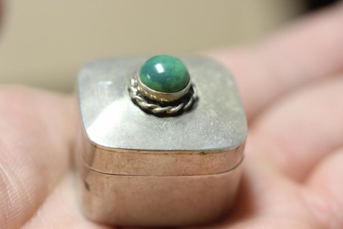 A Sterling Pill Box with Gem Stone: Most likely torquoise - one inch long
