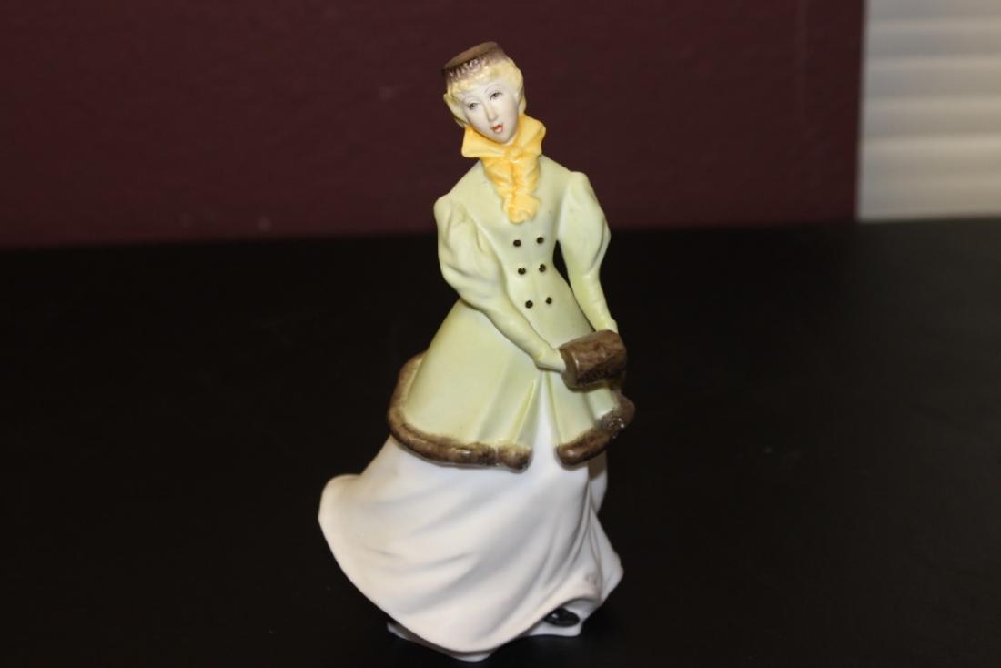 A Vintage Royal Worcester Figurine: 7 3/4 inches tall