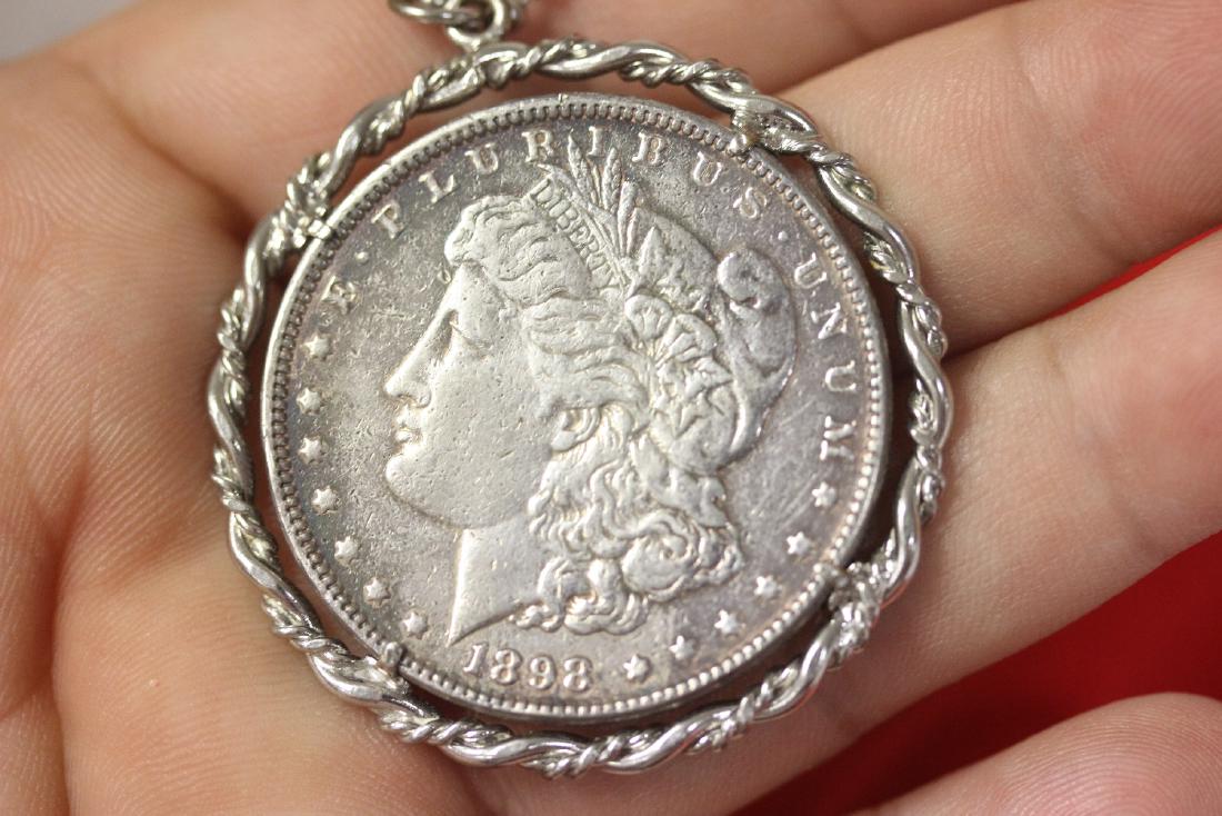 An 1898 Morgan silver Dollar: Made into a necklace