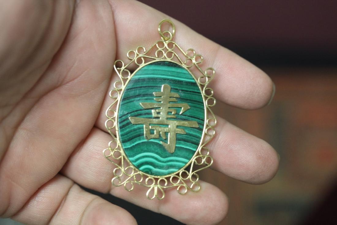 A Malachite and Gold Plated Chinese Character Pendant: as shown