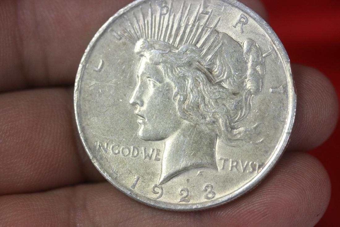 A 1923 Peace Silver Dollar: Bumped