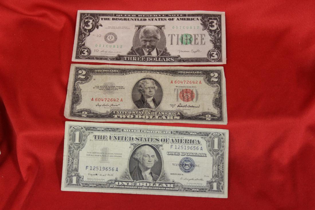 Lot of 3 Bank Notes: One Dollar blue seal - Two Dollar red seal - and a fake Three Dollar note
