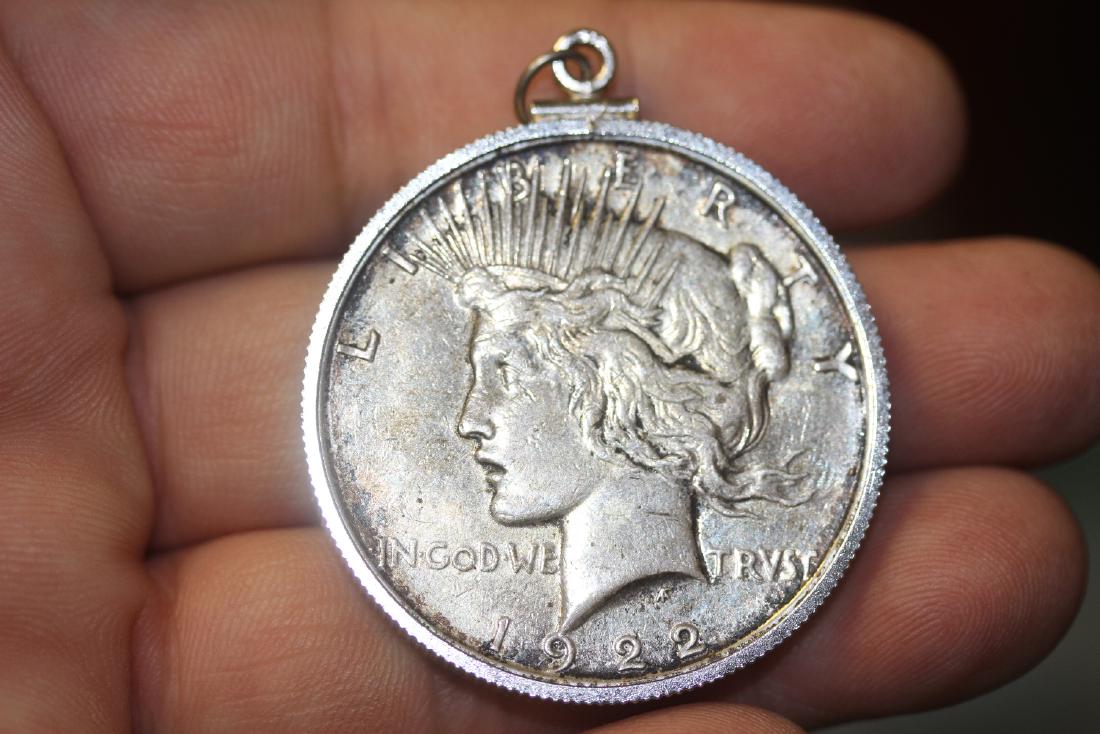 A 1922-D Peace Silver Dollar: Made into a pendant