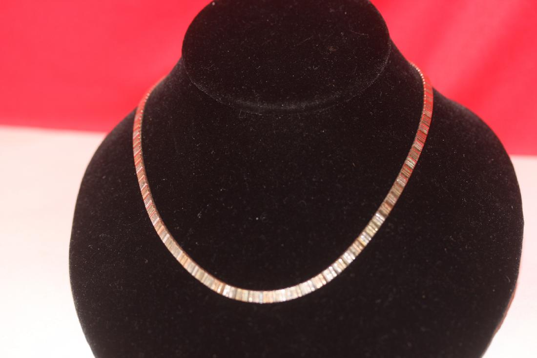 A Sterling Silver Choker Necklace: 16" long when unclapsed