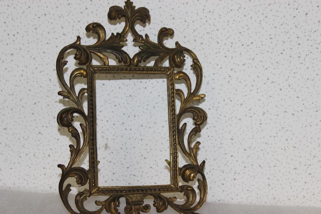 A Cast Iron Picture Frame - Vintage: overall= 12 1/2" long - inside diameter= 6" x 4"